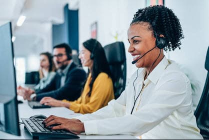 Business professionals working at computers in an office